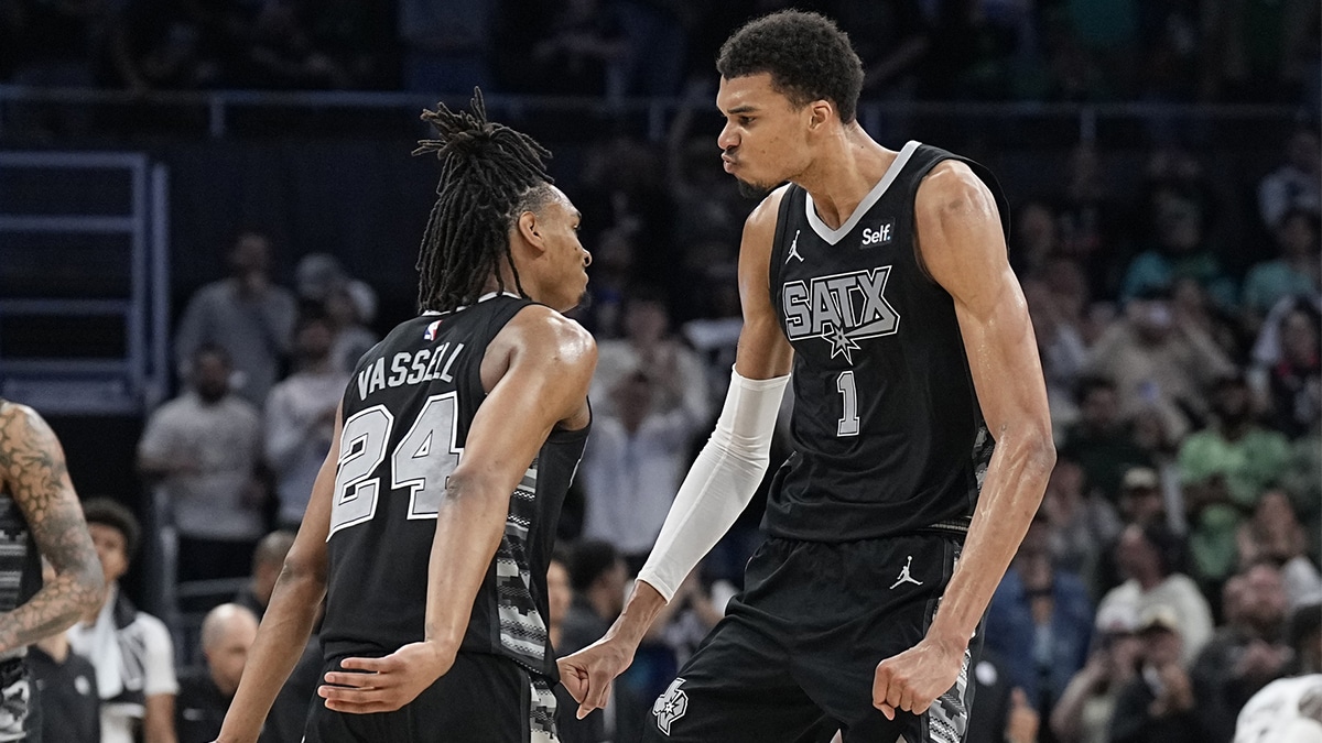 San Antonio Spurs forward Victor Wembanyama (1) and guard Devin Vassell (24) react during overtime against the Brooklyn Nets at Moody Center. 