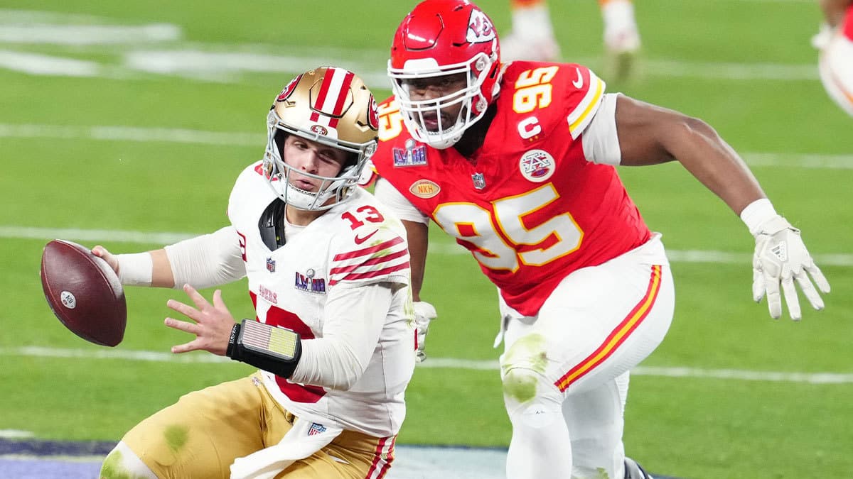 San Francisco 49ers quarterback Brock Purdy (13) is pressured by Kansas City Chiefs defensive tackle Chris Jones (95) in the second half in Super Bowl LVIII at Allegiant Stadium