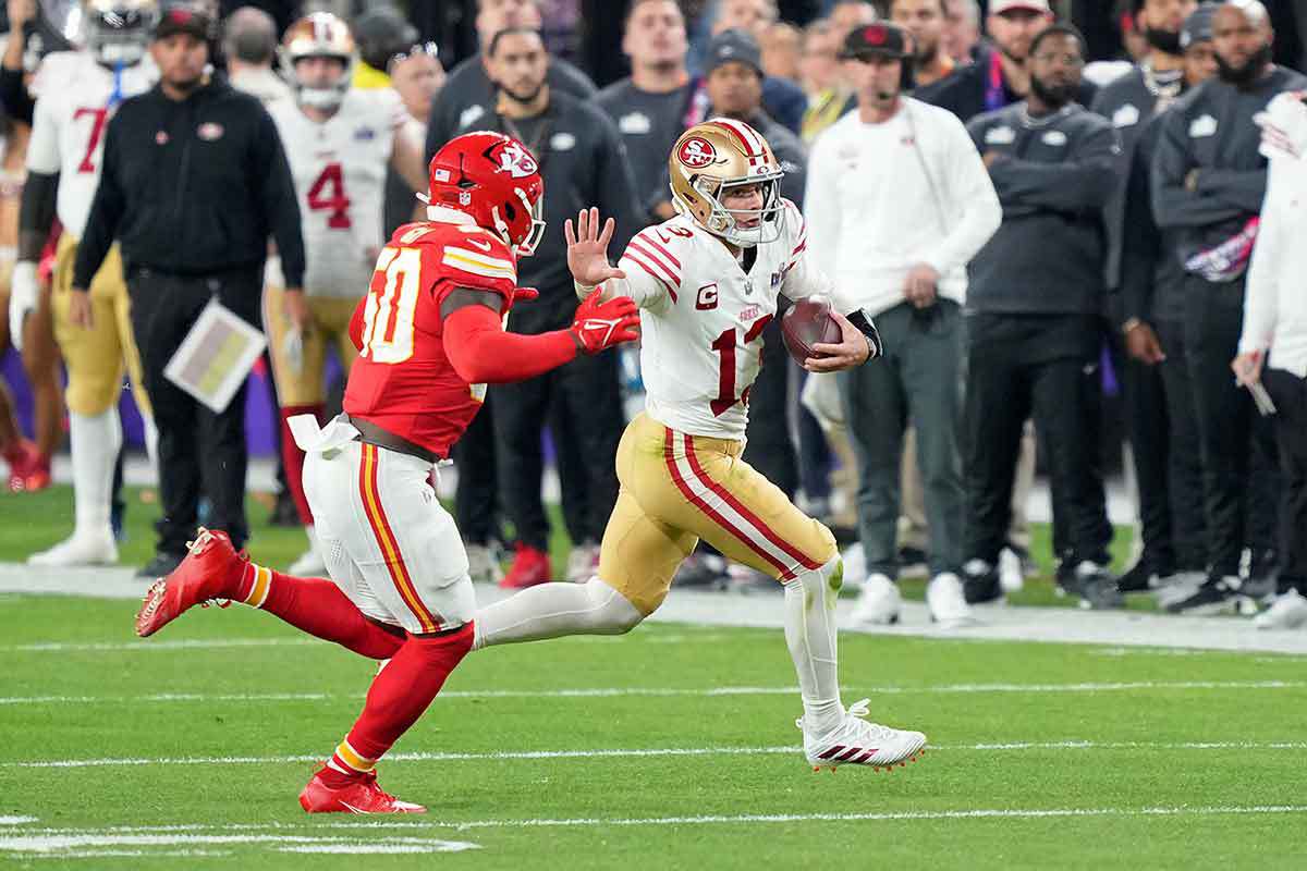 San Francisco 49ers quarterback Brock Purdy (13) runs with the ball against Kansas City Chiefs linebacker Willie Gay (50) 