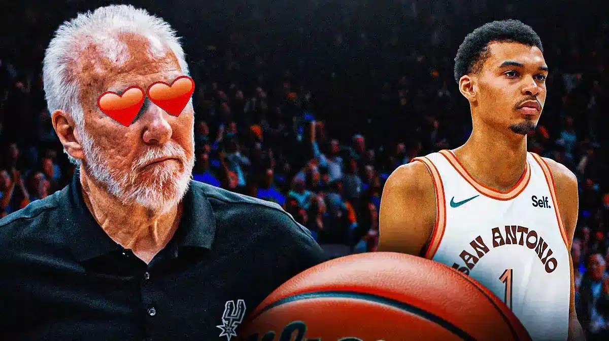 Spurs coach Gregg Popovich with heart emoji eyes looking at Victor Wembanyama