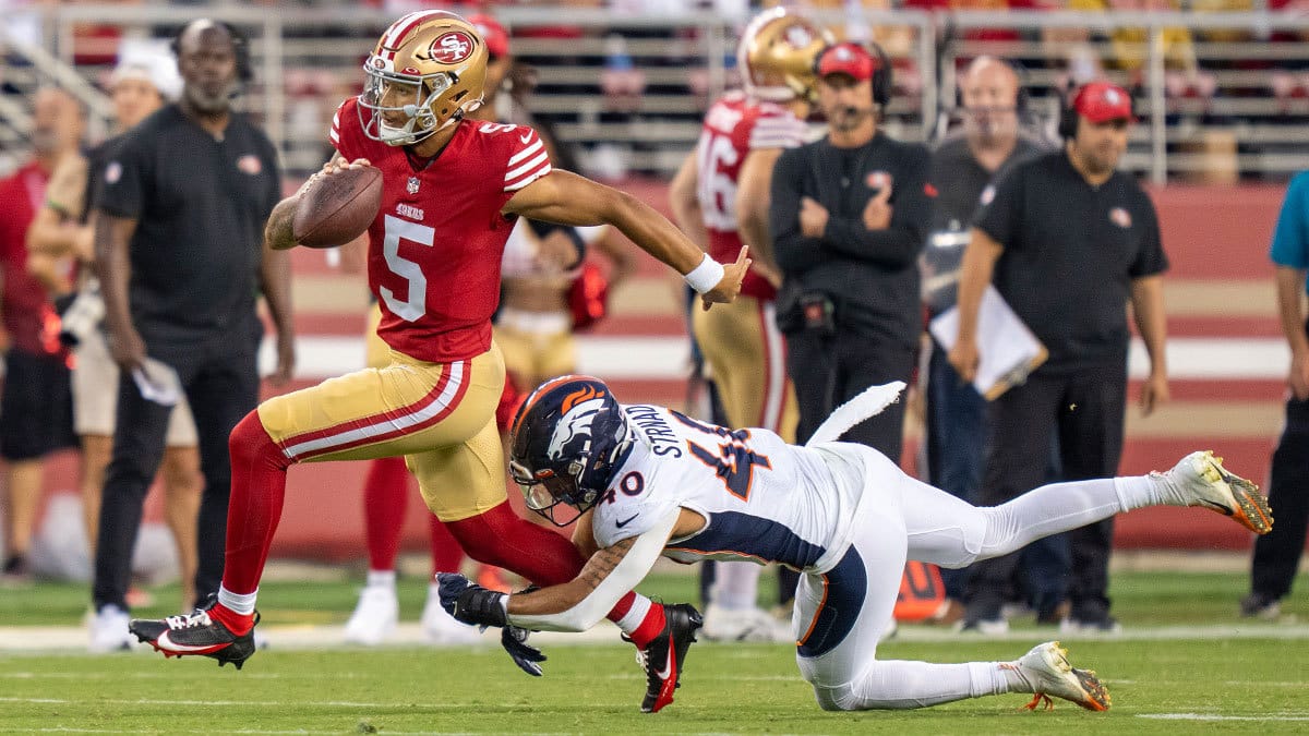 San Francisco 49ers quarterback Trey Lance (5) is tackled by Denver Broncos linebacker Justin Strnad (40) 