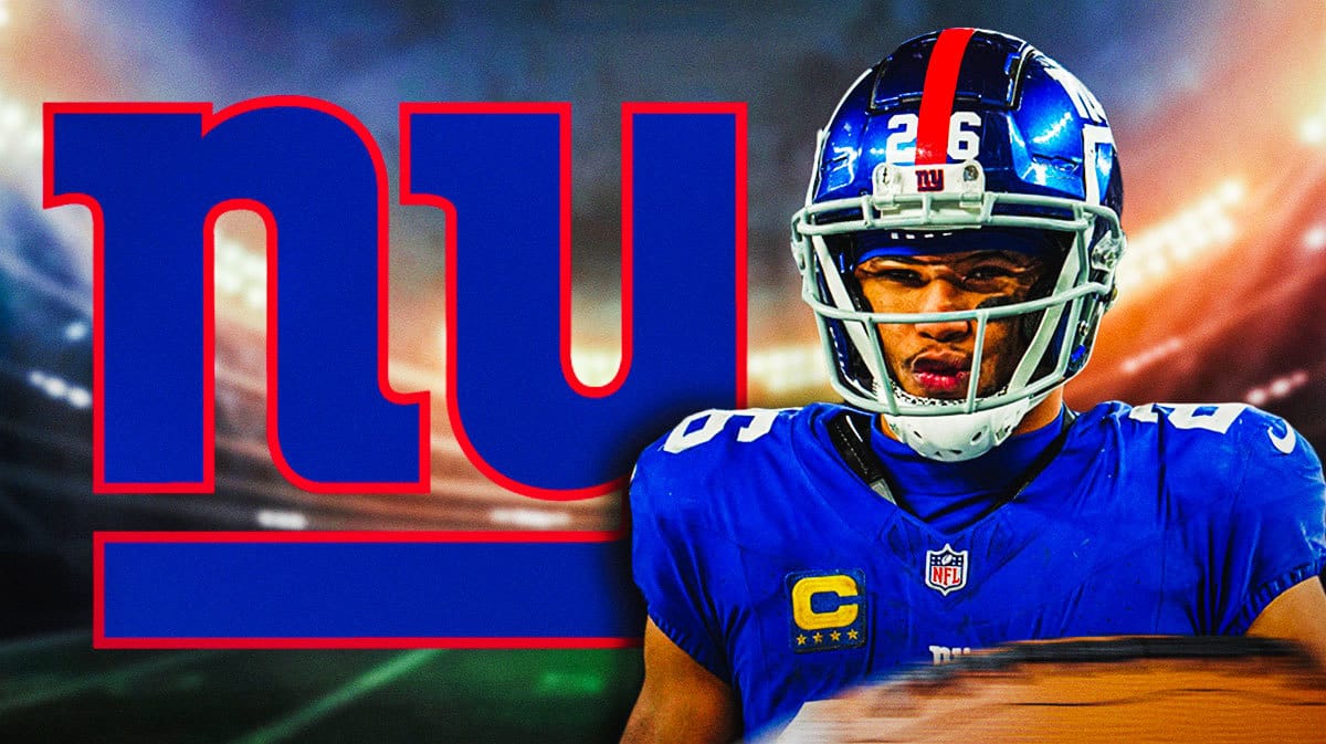 Saquon Barkley stands next to Giants logo after signing NFL free agency contract, Eagles fans look from background