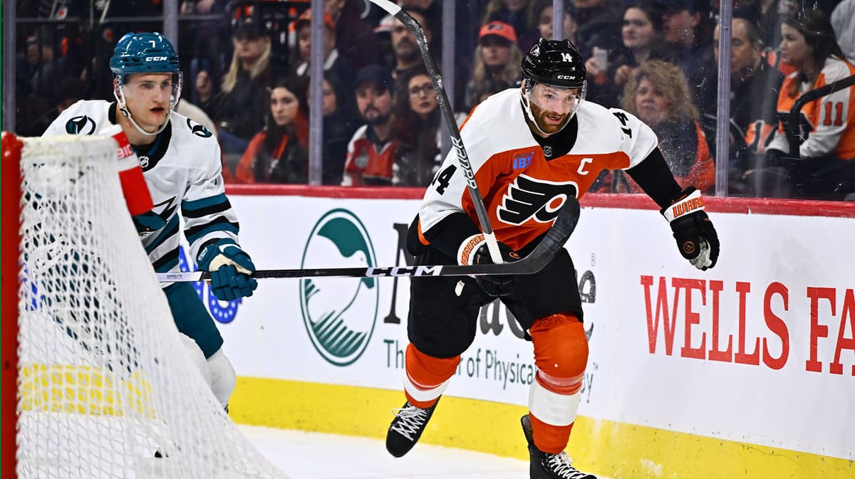 Philadelphia Flyers center Sean Couturier (14) skates against San Jose Sharks center Nico Sturm (7) in the first period at Wells Fargo Center.