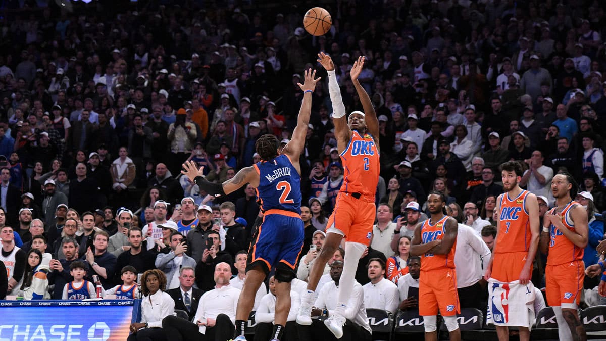 Oklahoma City Thunder guard Shai Gilgeous-Alexander (2) hits the game winning basket with 1.8 seconds remaining in the fourth quarter while being defended by New York Knicks guard Miles McBride (2) at Madison Square Garden.