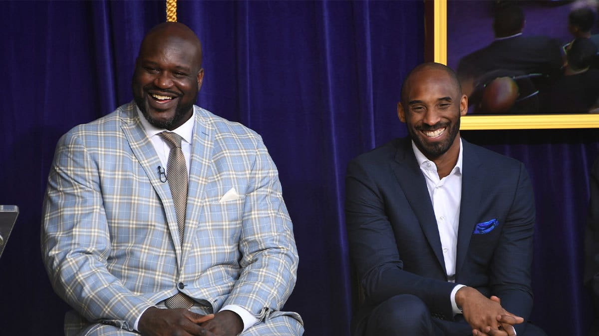Los Angeles Lakers former center Shaquille O'Neal (left) and guard Kobe Bryant react during ceremony to unveil statue of O'Neal at Staples Center.