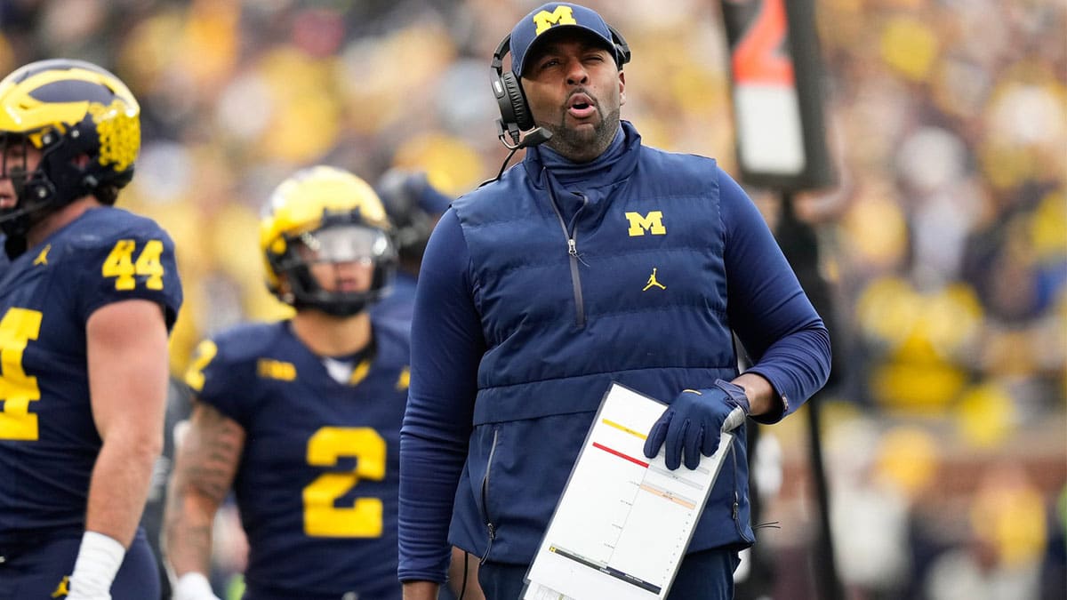 Nov 25, 2023; Ann Arbor, Michigan, USA; Michigan Wolverines interim head coach Sherrone Moore gestures on the sideline during the second half of the NCAA football game against the Ohio State Buckeyes at Michigan Stadium. Ohio State lost 30-24.