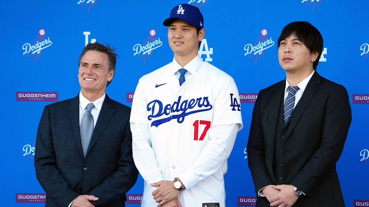 Los Angeles Dodgers player Shohei Ohtani stands with his agent Nez Balelo (left) and interpreter Ippei Mizuhara at an introductory press conference at Dodger Stadium. 