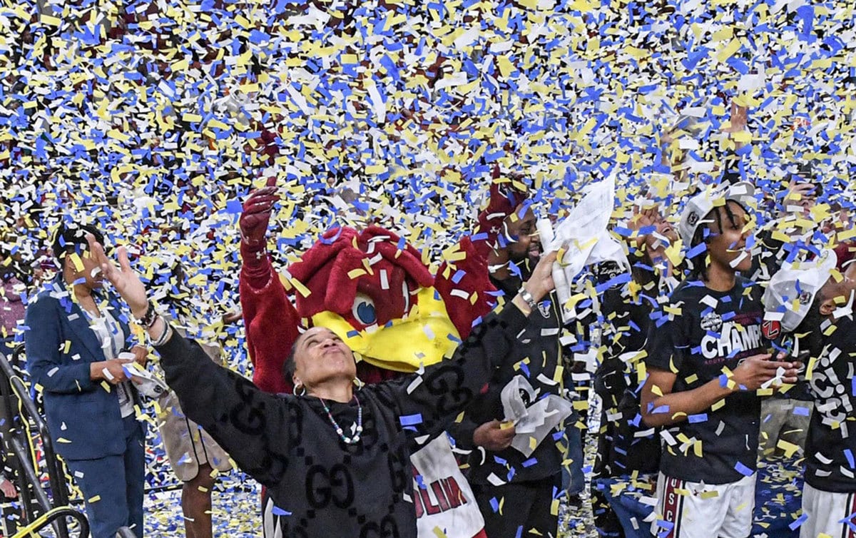 South Carolina Coach Dawn Staley celebrates with the team after the SEC Women's Basketball Tournament Championship at the Bon Secours Wellness Arena in Greenville, S.C. Sunday, March 10, 2024.