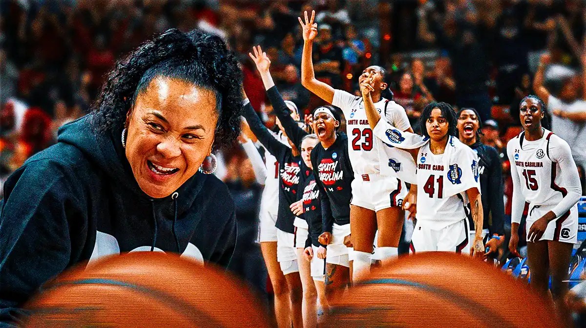 South Carolina women's basketball team celebrating with coach Dawn Staley.