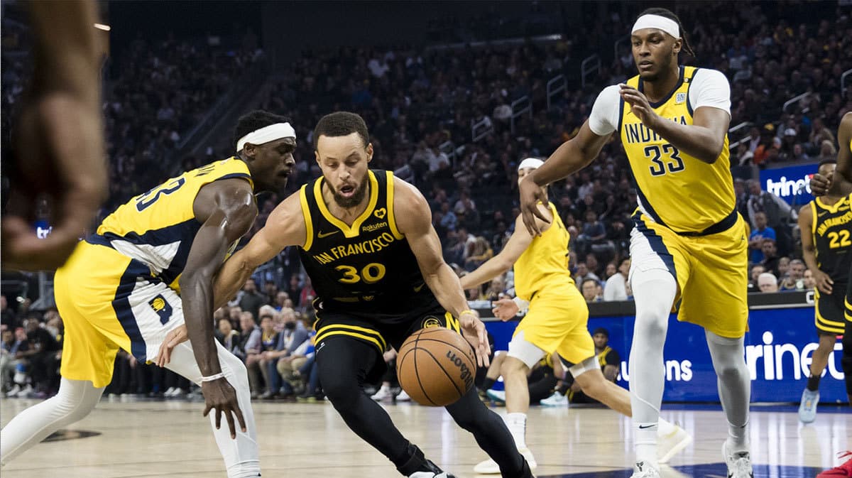 Golden State Warriors guard Stephen Curry (30) drives past Indiana Pacers forward Pascal Siakam (43) during the first half at Chase Center. 