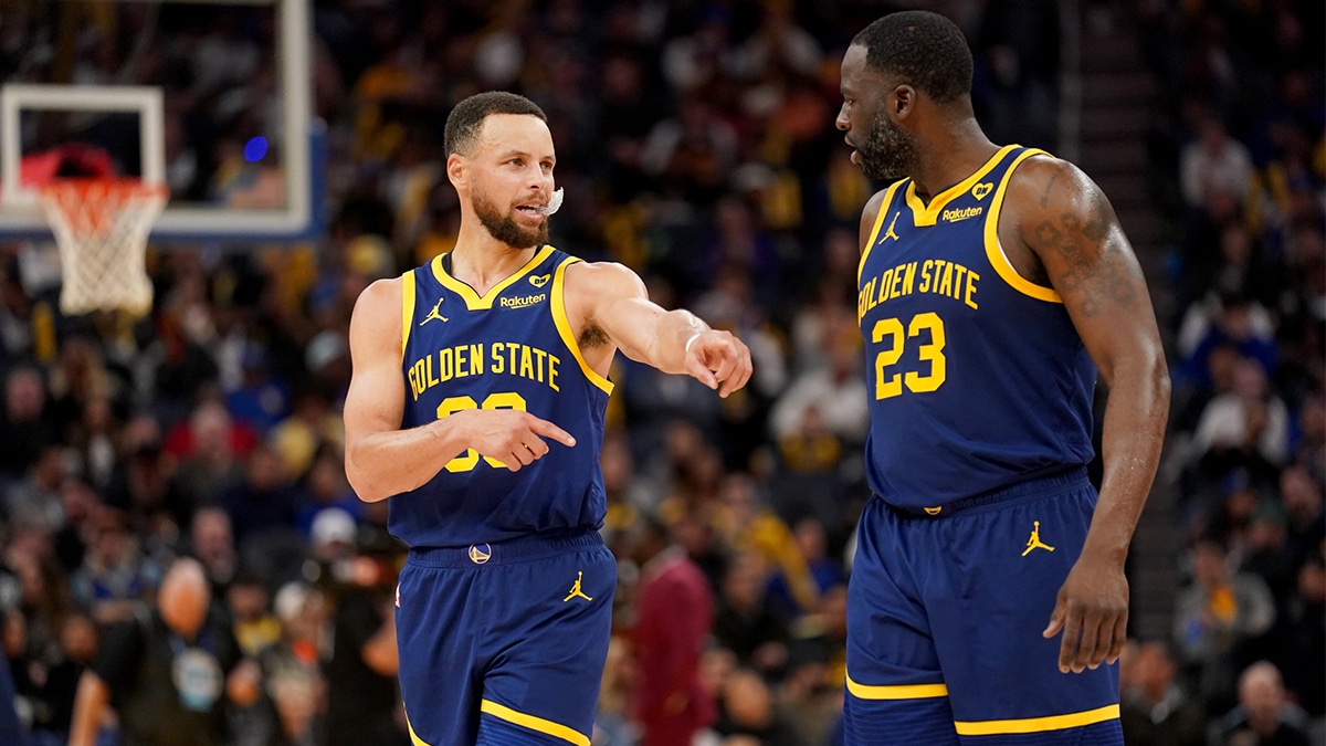 Feb 22, 2024; San Francisco, California, USA; Golden State Warriors guard Stephen Curry (30) talks with forward Draymond Green (23) after a timeout against the Los Angeles Lakers in the third quarter at the Chase Center.