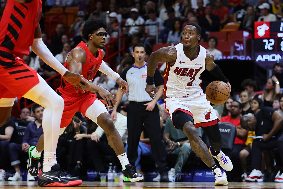 Miami Heat guard Terry Rozier (2) drives to the basket past Portland Trail Blazers guard Scoot Henderson (00) during the second quarter at Kaseya Center.
