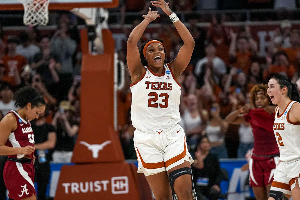 Texas Longhorns forward Aaliyah Moore (23) celebrates as time expires in the NCAA playoff game against Alabama at the Moody Center on Sunday
