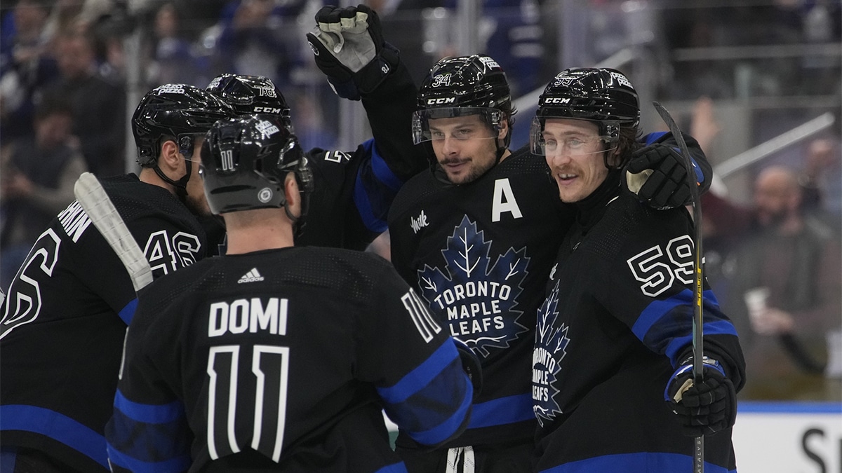 Toronto Maple Leafs forward Tyler Bertuzzi (59) celebrates his goal against the Washington Capitals with Toronto Maple Leafs forward Auston Matthews (34) and forward Max Domi (11) during the third period at Scotiabank Arena.
