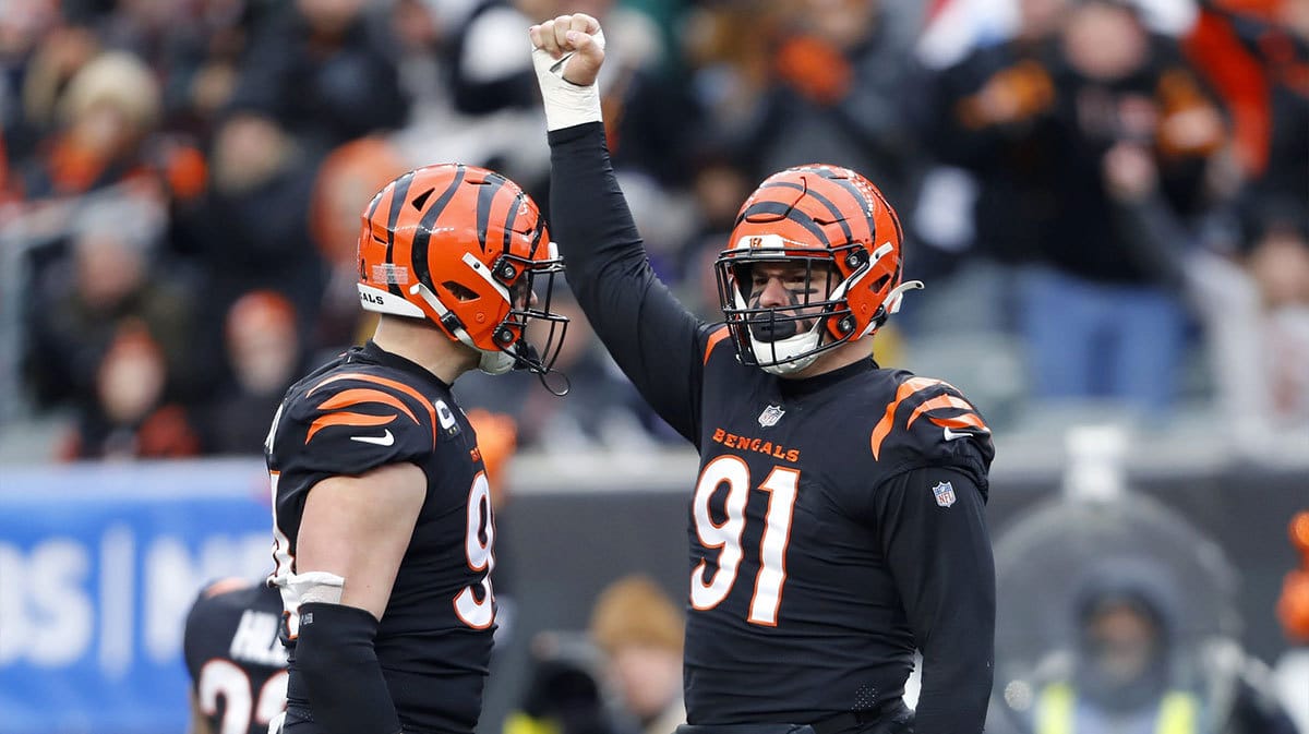 Cincinnati Bengals defensive end Trey Hendrickson (91) celebrates the sack with defensive end Sam Hubbard (94) during the fourth quarter against the Baltimore Ravens at Paycor Stadium.