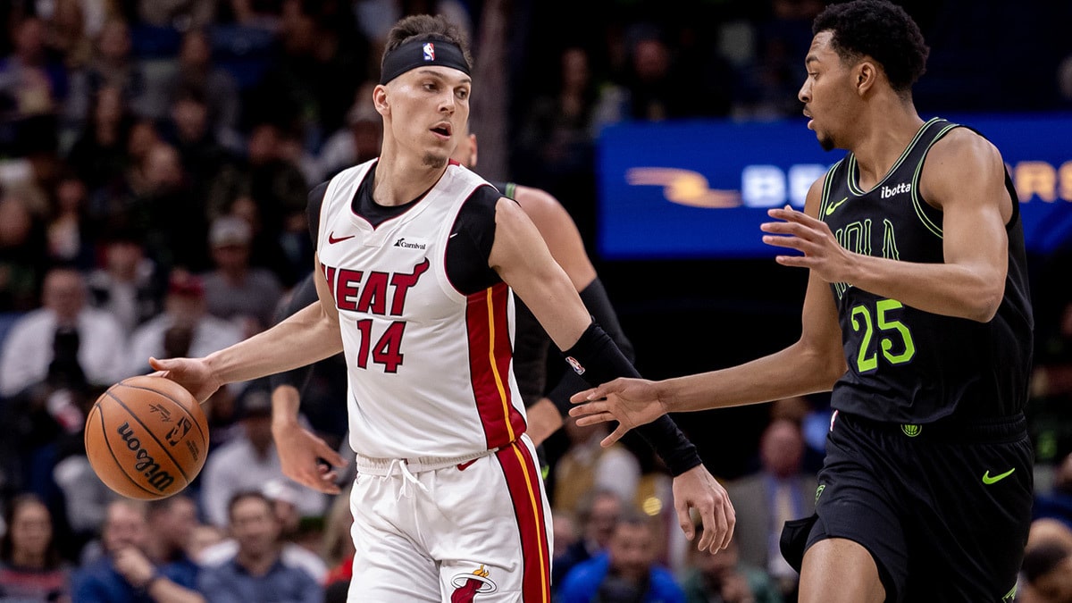 Miami Heat guard Tyler Herro (14) brings the ball up court against New Orleans Pelicans guard Trey Murphy III (25) during the first half at Smoothie King Center.