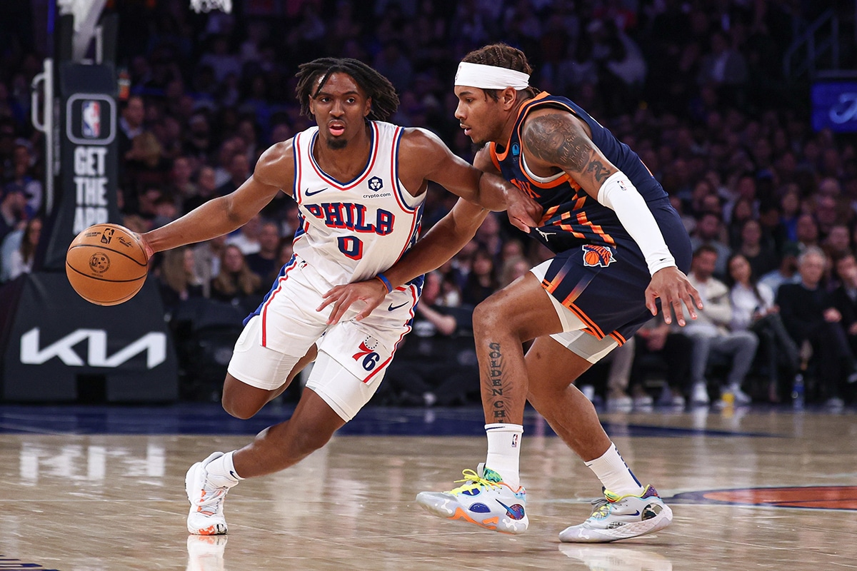  Philadelphia 76ers guard Tyrese Maxey (0) dribbles against New York Knicks guard Miles McBride (2) during the second quarter at Madison Square Garden. 