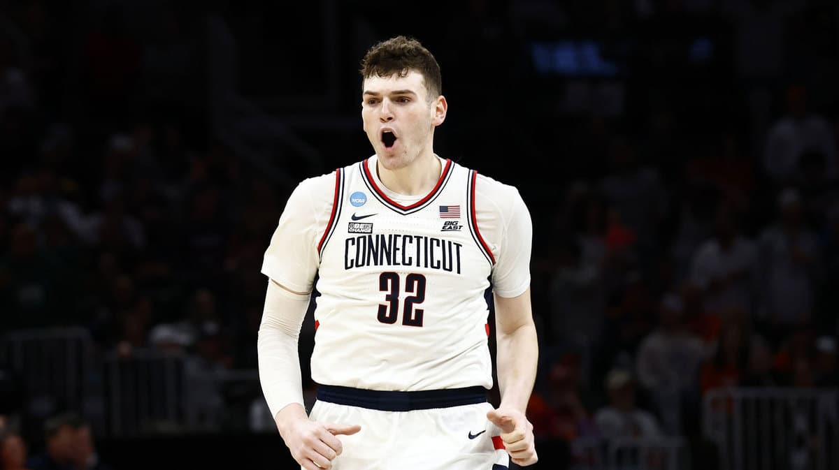 Connecticut Huskies center Donovan Clingan (32) reacts against the Illinois Fighting Illini in the finals of the East Regional of the 2024 NCAA Tournament at TD Garden