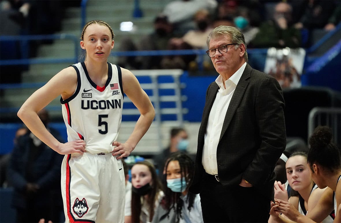 UConn Huskies head coach Geno Auriemma talks with guard Paige Bueckers (5) from the sideline as they take on the St. John's Red Storm