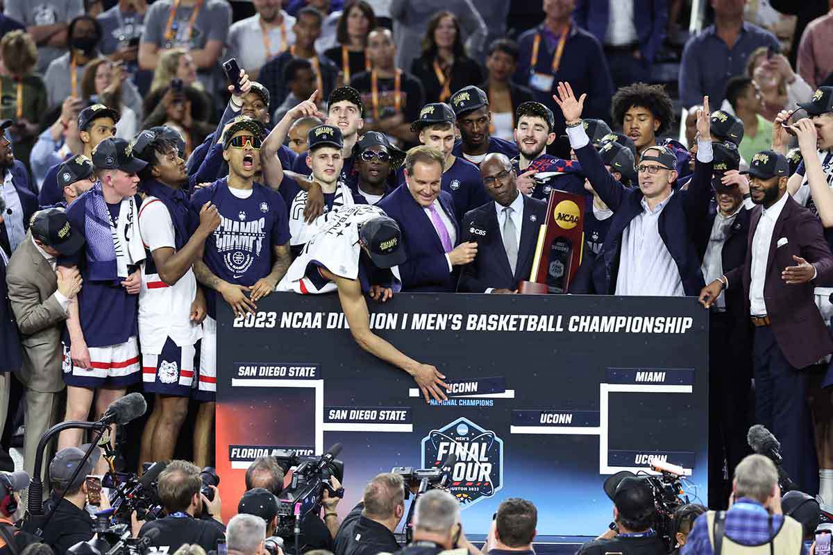 UConn celebrating winning March Madness in 2023