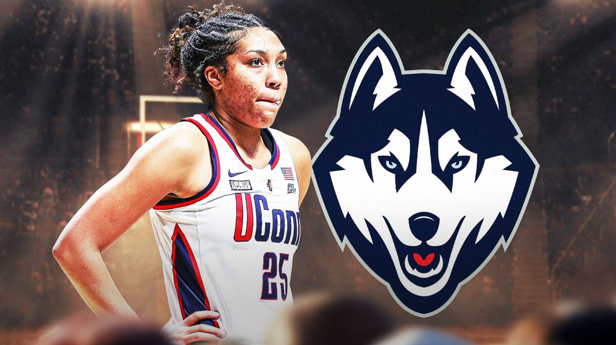 UConn's Ice Brady with the UConn Huskies logo in the background