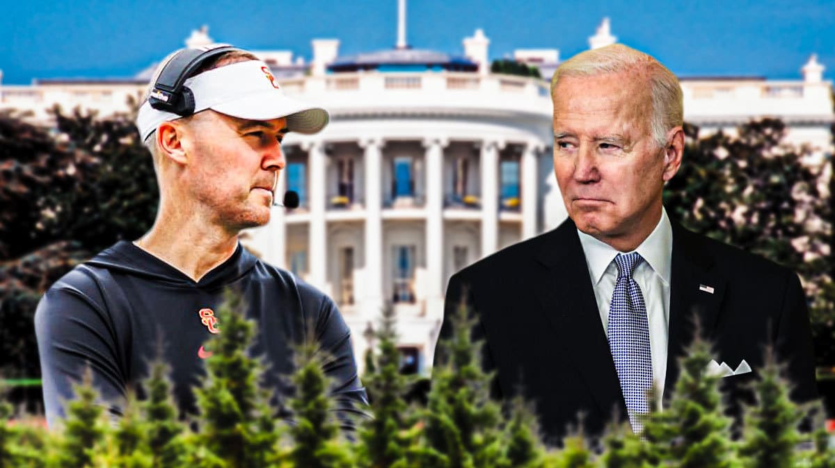 USC football HC Lincoln Riley with Joe Biden looking.