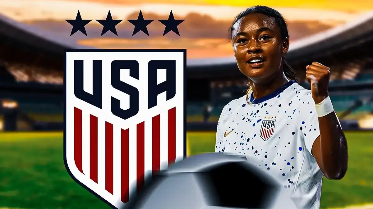 Jaedyn Shaw celebrating in front of the USWNT logo