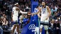 Minnesota Timberwolves forward Jaden McDaniels (3) celebrates with Minnesota Timberwolves center Rudy Gobert (27) during the third quarter against the Dallas Mavericks at American Airlines Center.