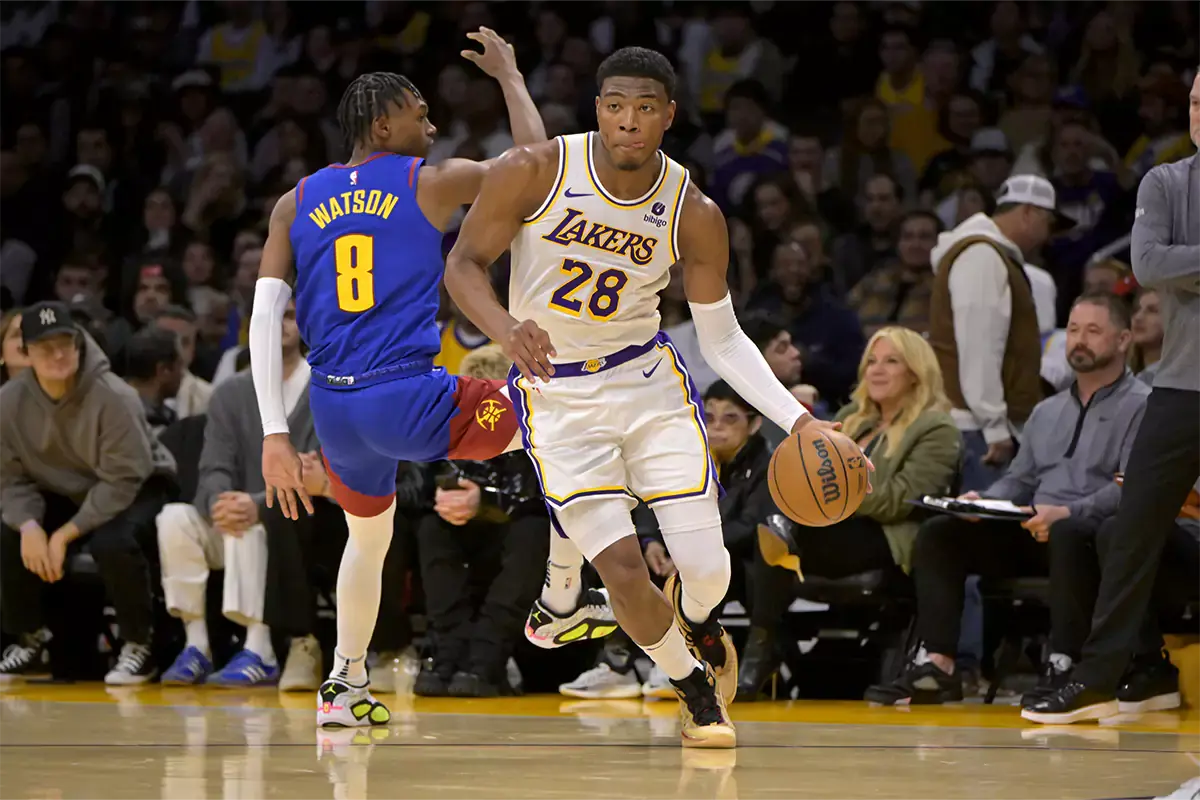 Los Angeles Lakers forward Rui Hachimura (28) drives past Denver Nuggets guard Christian Braun (0) in the second half at Crypto.com Arena.