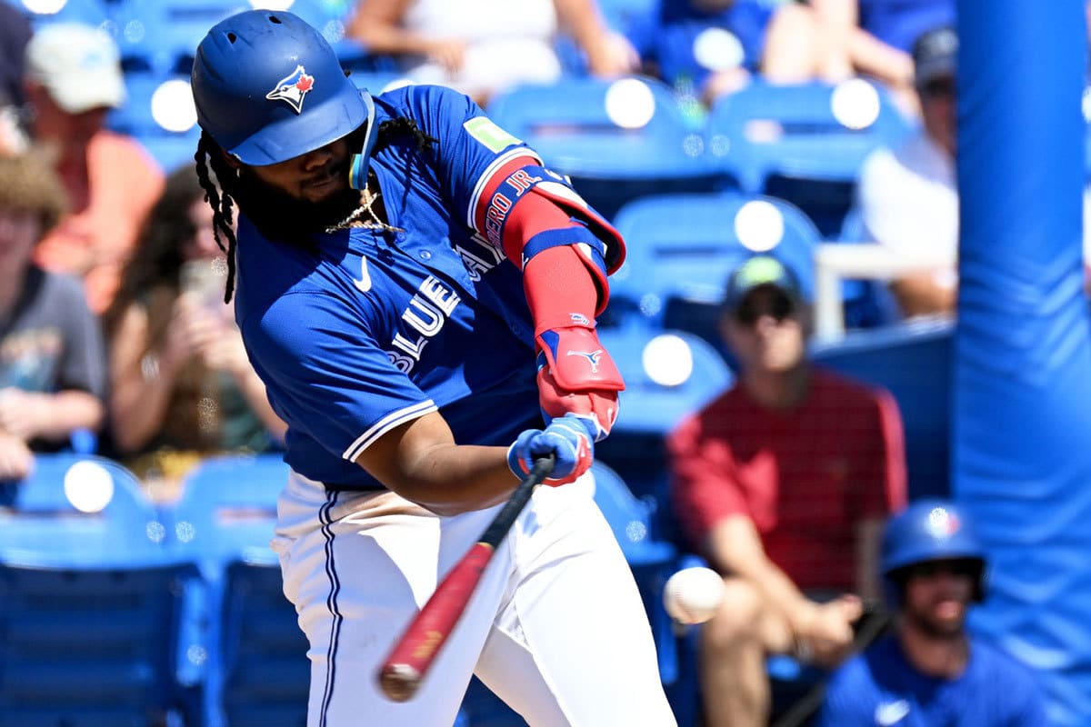 Toronto Blue Jays first baseman Vladimir Guerrero Jr. (27) drives in two runs with a single in the first inning of a spring training game against the Detroit Tigers at TD Ballpark.