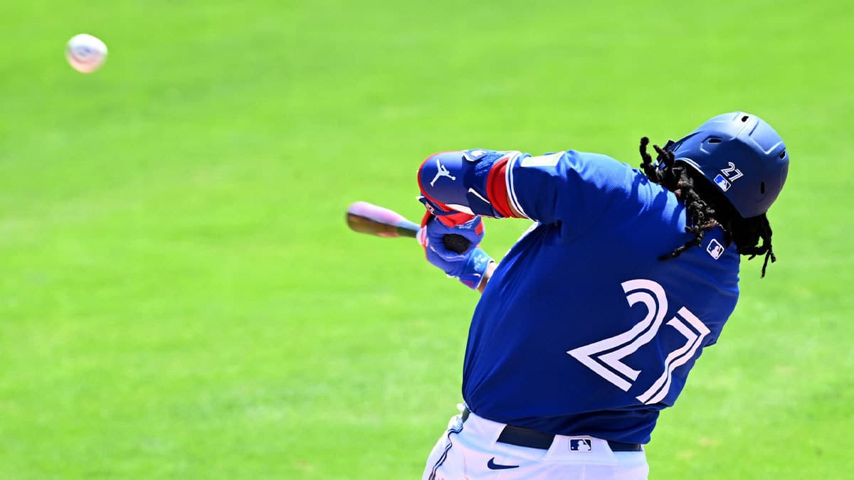 Toronto Blue Jays first baseman Vladimir Guerrero Jr. (27) hits a line drive in the third inning of a spring training game against the Detroit Tigers at TD Ballpark.