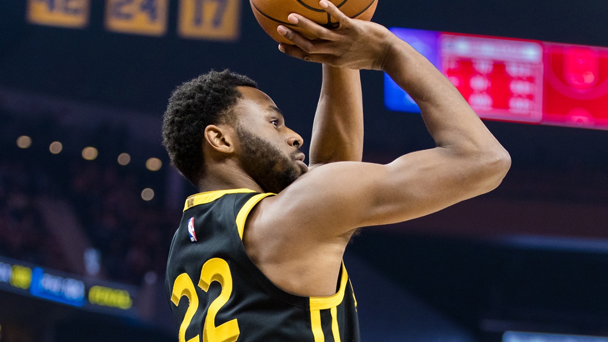 Golden State Warriors forward Andrew Wiggins (22) takes a three-point shot against the LA Clippers during the first half at Chase Center