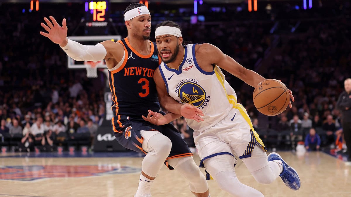 Golden State Warriors guard Moses Moody (4) drives to the basket against New York Knicks guard Josh Hart (3) during the third quarter at Madison Square Garden.