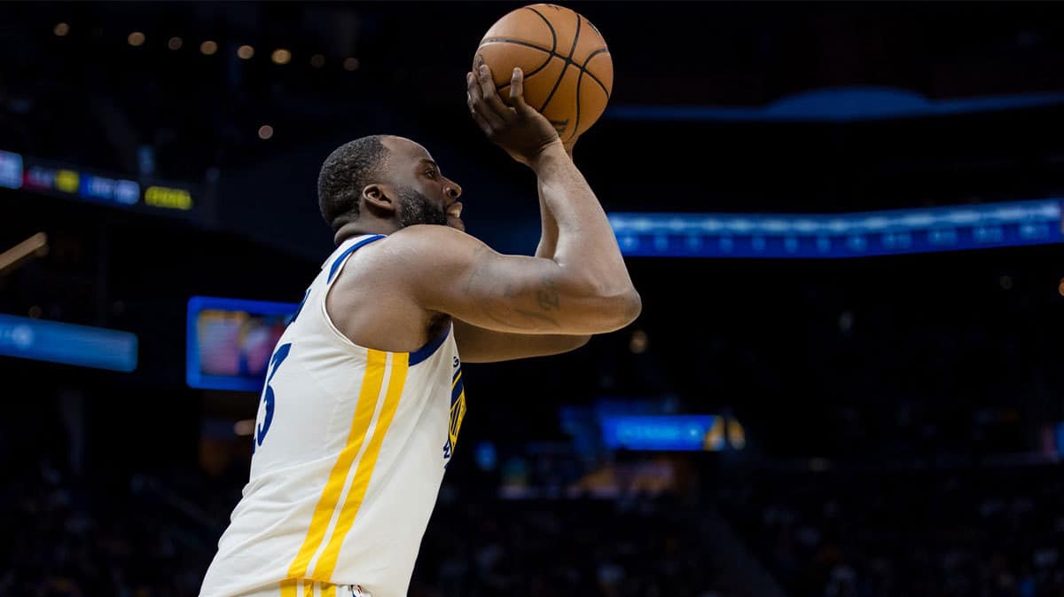 Golden State Warriors center Draymond Green (23) takes a three-point shot against the New York Knicks during the second half at Chase Center.