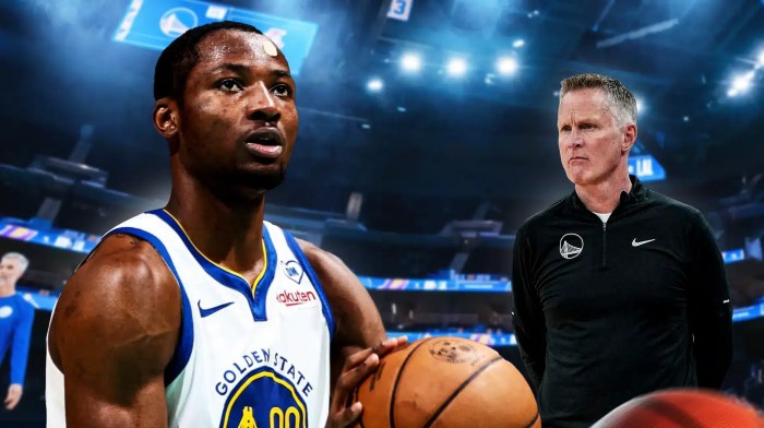 Jonathan Kuminga alongside Steve Kerr with the Warriors arena in the background