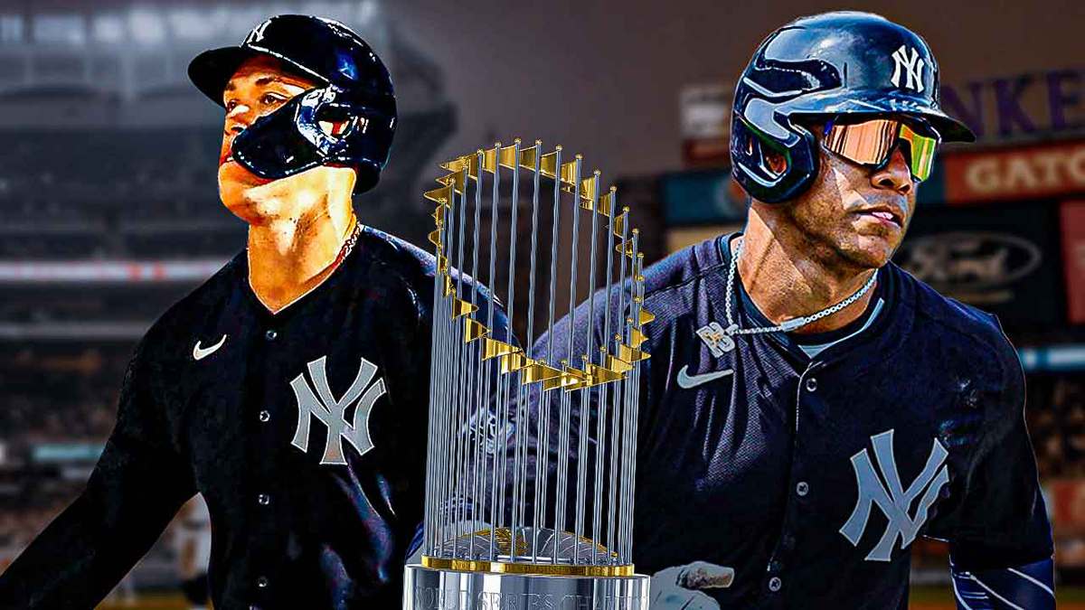 Yankees' Juan Soto on left, Yankees' Aaron Judge on right. MLB World Series Trophy in middle. Yankee Stadium background.