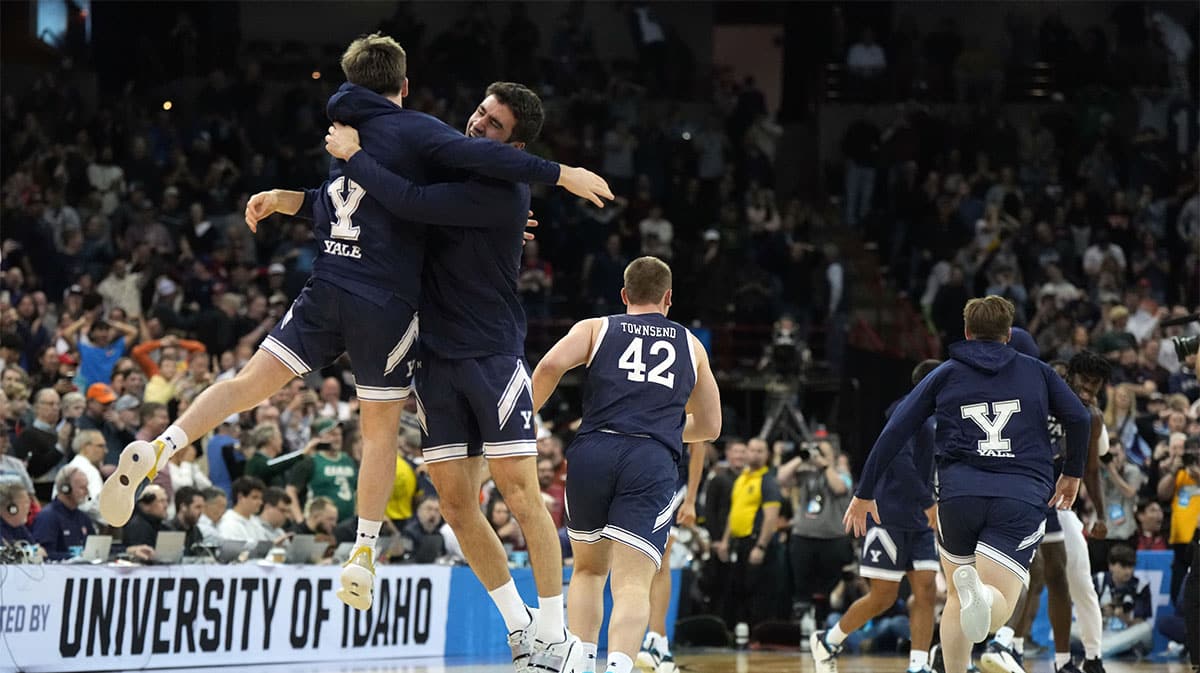 Yale Bulldogs guard Trevor Mullin (0) celebrates with guard Emir Buyukhanli (11) after a game against the Auburn Tigers in the first round of the 2024 NCAA Tournament at Spokane Veterans Memorial Arena. 
