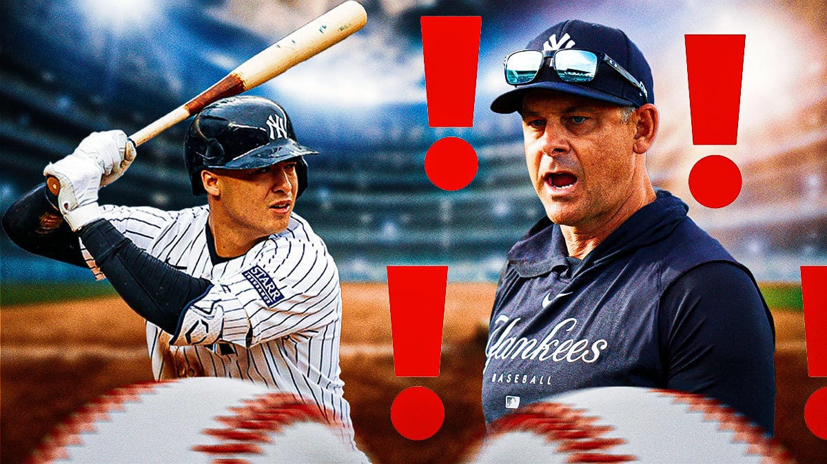 Yankees' Aaron Boone with two Metal Gear alert symbols, with a swinging Anthony Volpe beside Boone
