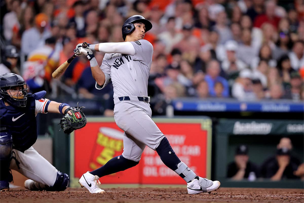 New York Yankees third baseman Oswaldo Cabrera (95) hits a two-run home run to right field against the Houston Astros during the seventh inning at Minute Maid Park.