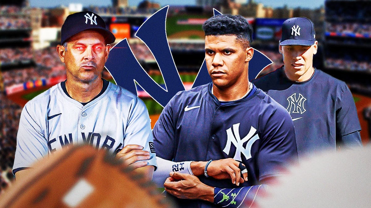 Yankees Aaron Boone with lasers in his eyes next to Yankees Aaron Judge and Juan Soto at Yankee Stadium