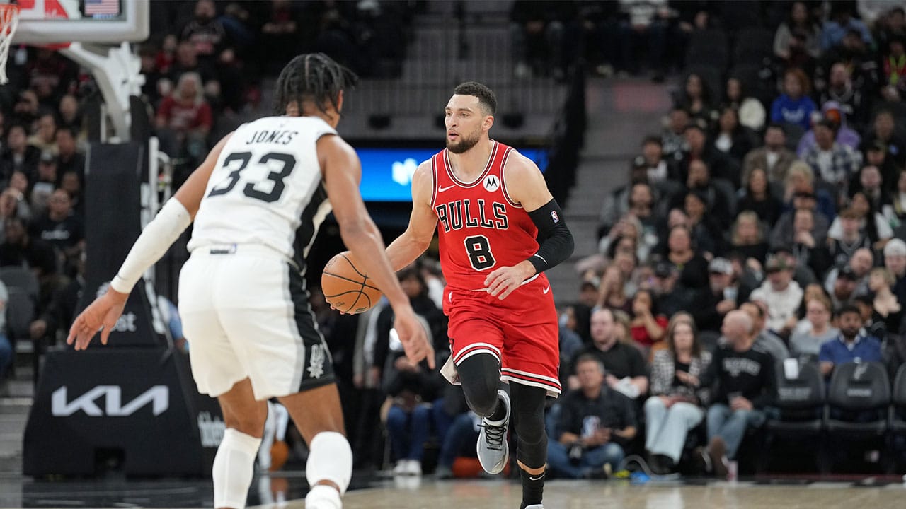 Chicago Bulls guard Zach LaVine (8) dribbles in front of San Antonio Spurs guard Tre Jones (33) in the first half at Frost Bank Center.