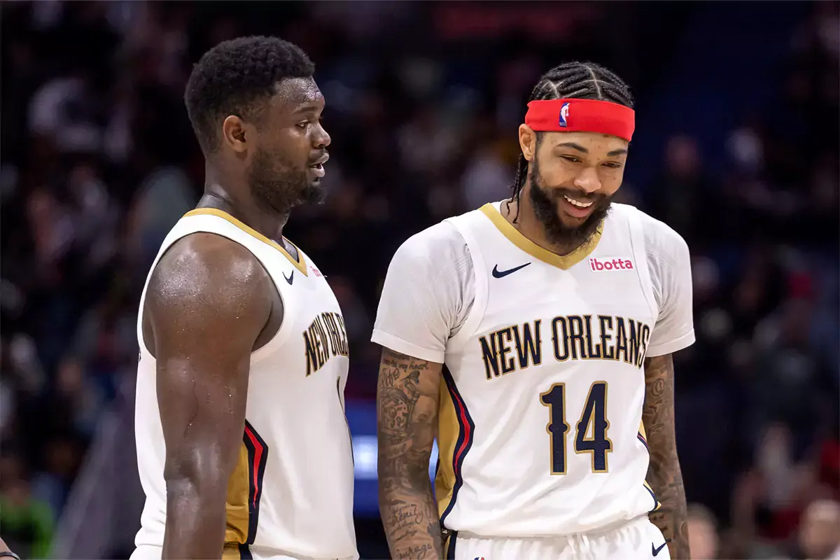 New Orleans Pelicans forward Zion Williamson (1) and forward Brandon Ingram (14) share a laugh after a play against the Los Angeles Lakers during the second half at Smoothie King Center