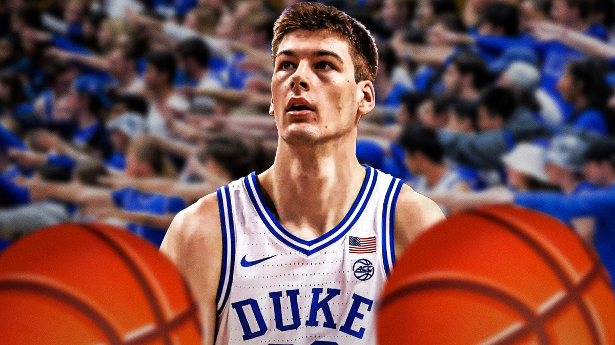 Duke basketball's Kyle Filipowski with basketballs next to him.