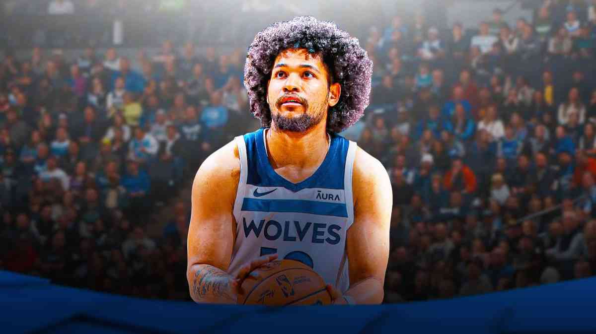 Daishen Nix in his Timberwolves jersey with the Timberwolves arena I the background