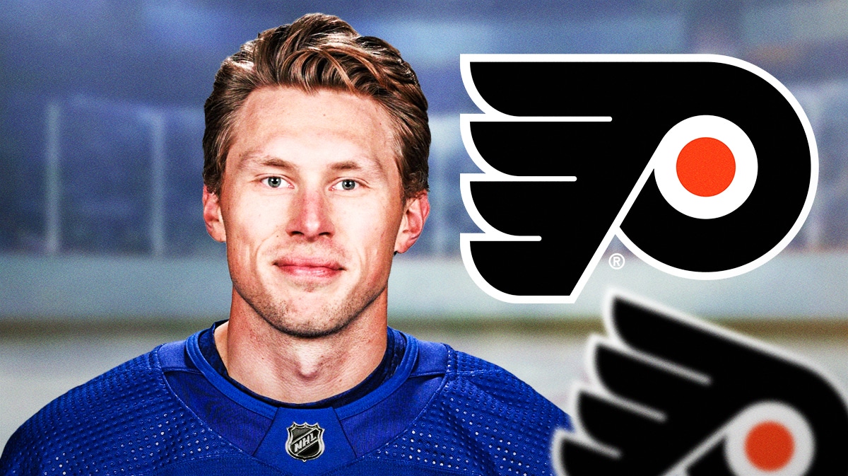 Erik Johnson with Flyers logo and hockey rink behind