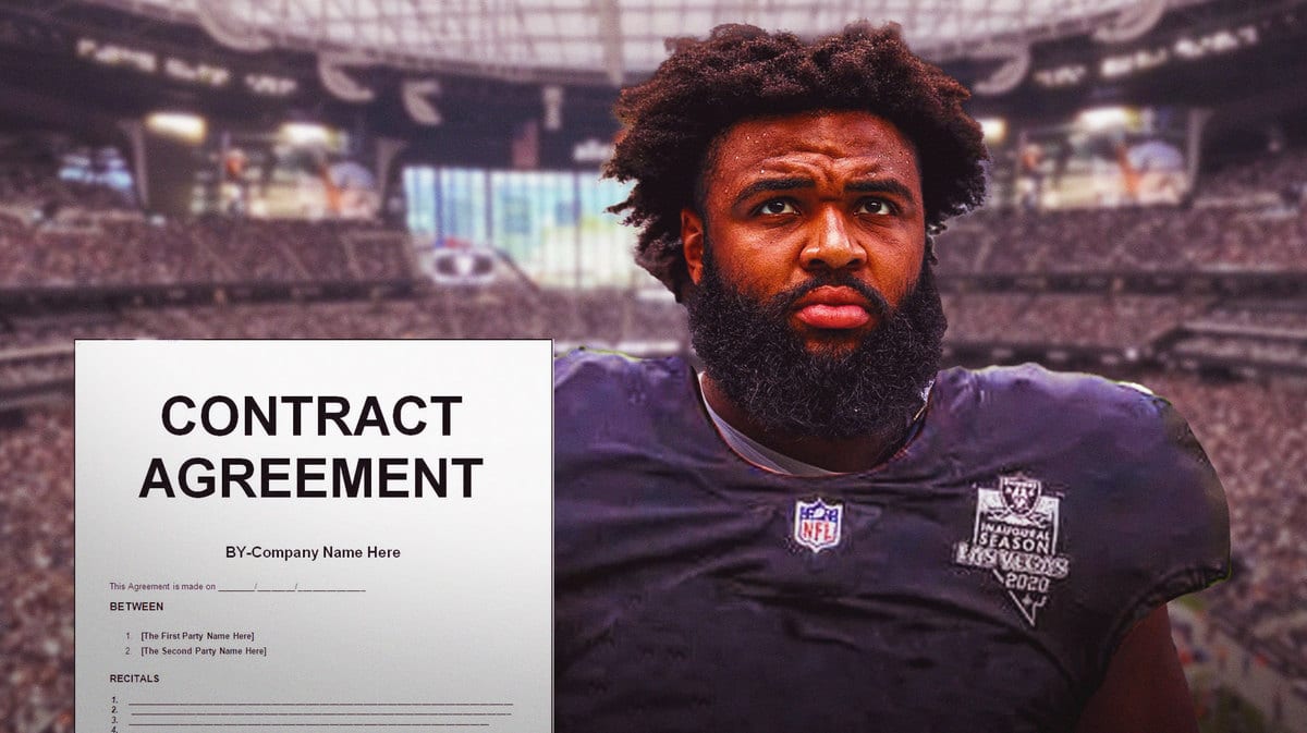 Raiders' new defensive tackle Christian Wilkins, a contract next to him