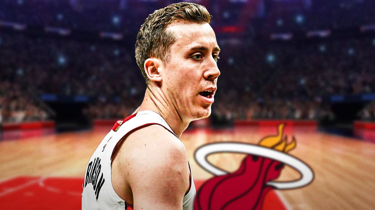 Miami Heat star Duncan Robinson in front of the Kaseya Center.