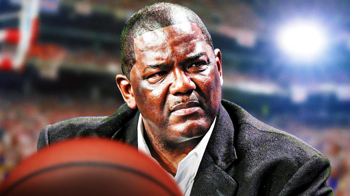 NBA Executive Joe Dumars in front of a basketball arena.