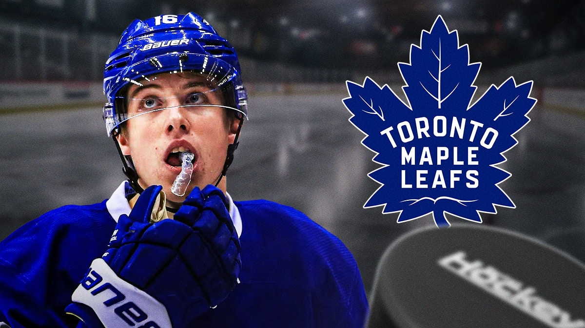 Mitch Marner in image looking hopeful, TOR Maple Leafs logo, hockey rink in background