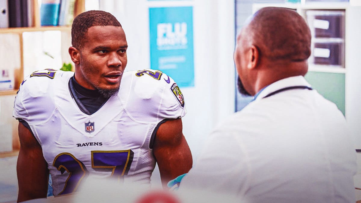 JK Dobbins talking with a doctor